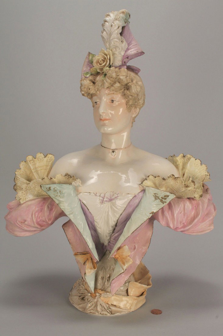 Ceramic Bust of an Edwardian Lady, 21" H, poss. Te: Porcelain portrait bust of an Edwardian lady dressed in high style. 21" H. German, possibly Teplitz, early 20th century.