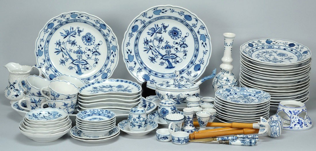 83 pcs German Porcelain, mostly Meissen oval mark: 83 pieces of German porcelain, most pieces having an oval "Meissen" mark and being in the Blue Onion pattern. Includes 6 salad plates, 9 cream soup bowls, 9 dinner plates, 7 egg cups, 1 milk pitcher 5