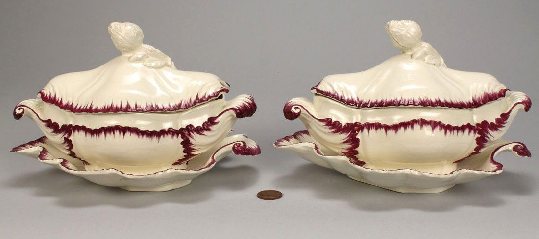 Pair creamware sauce tureens w/purple feather edge: Pair of creamware sauce tureens and underplates with mulberry or purple feather edge decoration and figural bulb finials, scrolled leaf design to body and side handles. Unmarked, possibly Leeds. Engli