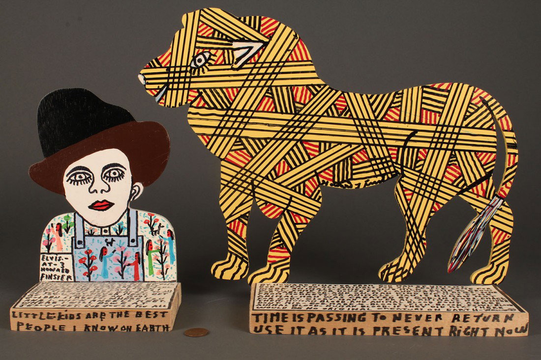 2 Howard Finster Painted Bookends: 2 Howard Finster (American, 1916-2001) painted bookends including cowboy painted bookend with phrase "Elvis at 3" depicting a young Elvis in overalls and hat (7 3/4" H x 5 1/4" W) and lion shaped book