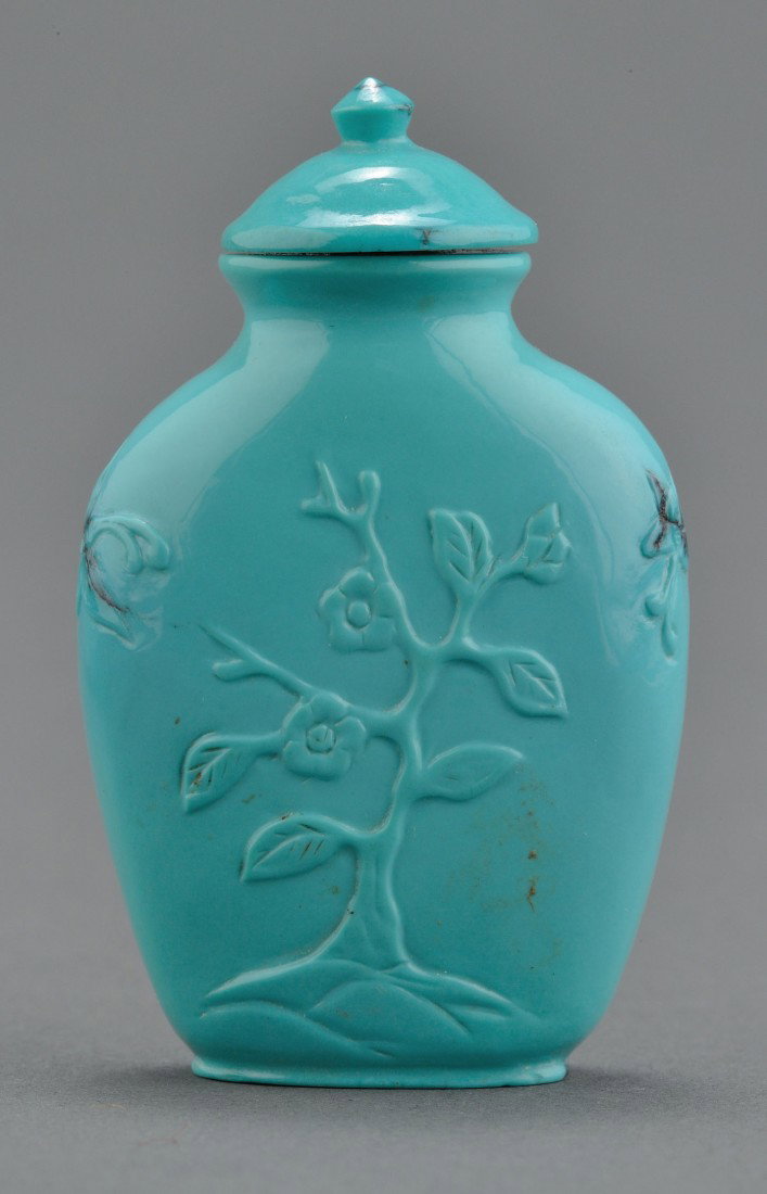 Chinese Carved Turquoise Snuff Bottle: Chinese carved turquoise snuff bottle, vase-shaped, with carved flowers and butterflies, en suite with lid. 2" H. 20th century.Provenance: From the collection of the late Fred C. Kennedy, a renowned m