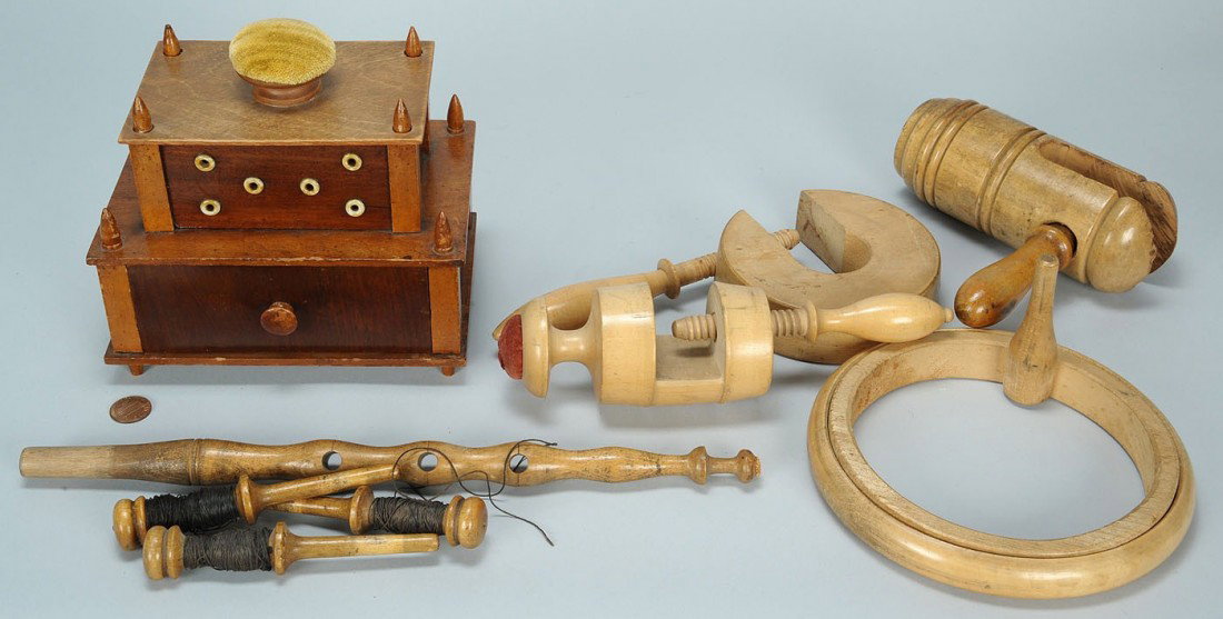 Shaker sewing box & wooden implements: Two tier Shaker sewing box with pincushion top lifting to reveal storage underneath over a drawer. Turned wood finials and ivory thread holes. Signed on base YA / 50. 6-1/2"H x 6-1/2" W x 4-1/2" D. Ci