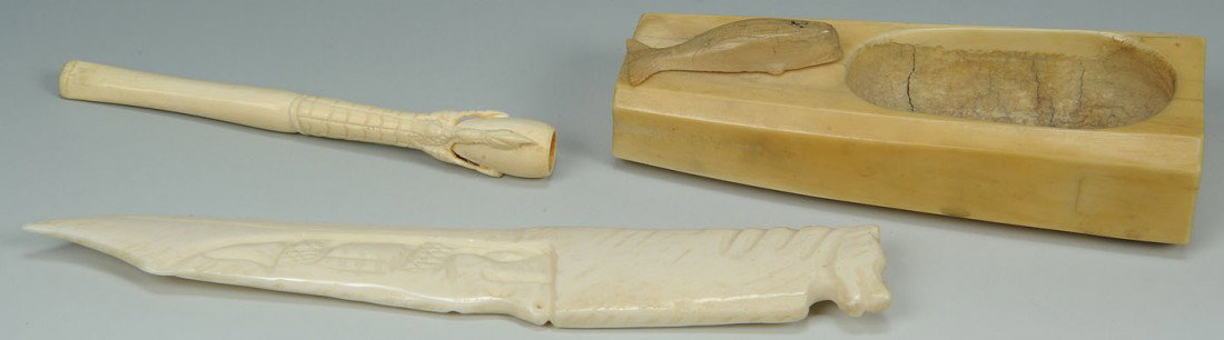 Grouping of Carved Inuit Walrus and Ivory Items: Grouping of Carved Inuit Walrus and Asian Ivory, early 20th century. 1ST ITEM: Inuit carved walrus tusk small mixing trough with attached whale decoration, 4-1/2" L. 2ND ITEM: Carved ivory cigarette h