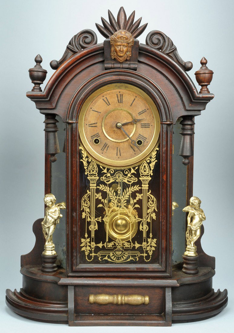 F. Kroeber Mirror Side Shelf Clock: F. Kroeber Clock Company, New York mahogany mirrored side shelf clock with Rice Johnson movements. Victorian Renaissance Revival style with gesso mask and flanking gilded cupid figurals. Finish appear