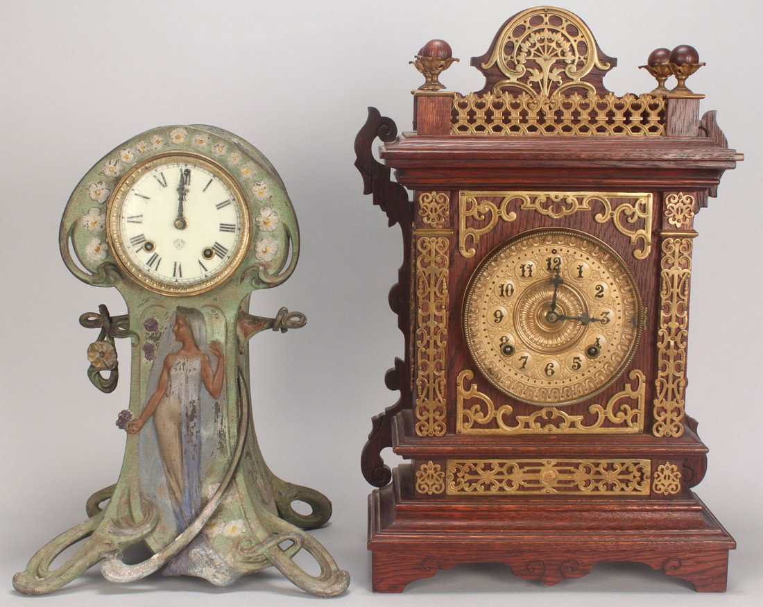 2 Ansonia clocks: Art Nouveau & Mantel w/ brass: 1ST ITEM: Ansonia Clock Co. Art Nouveau mantle clock, patinated spelter body with female figure and floral decoration, bronze and enameled clock face with trademark "A", circa 1900. 15" H x 9 1/2" W. 