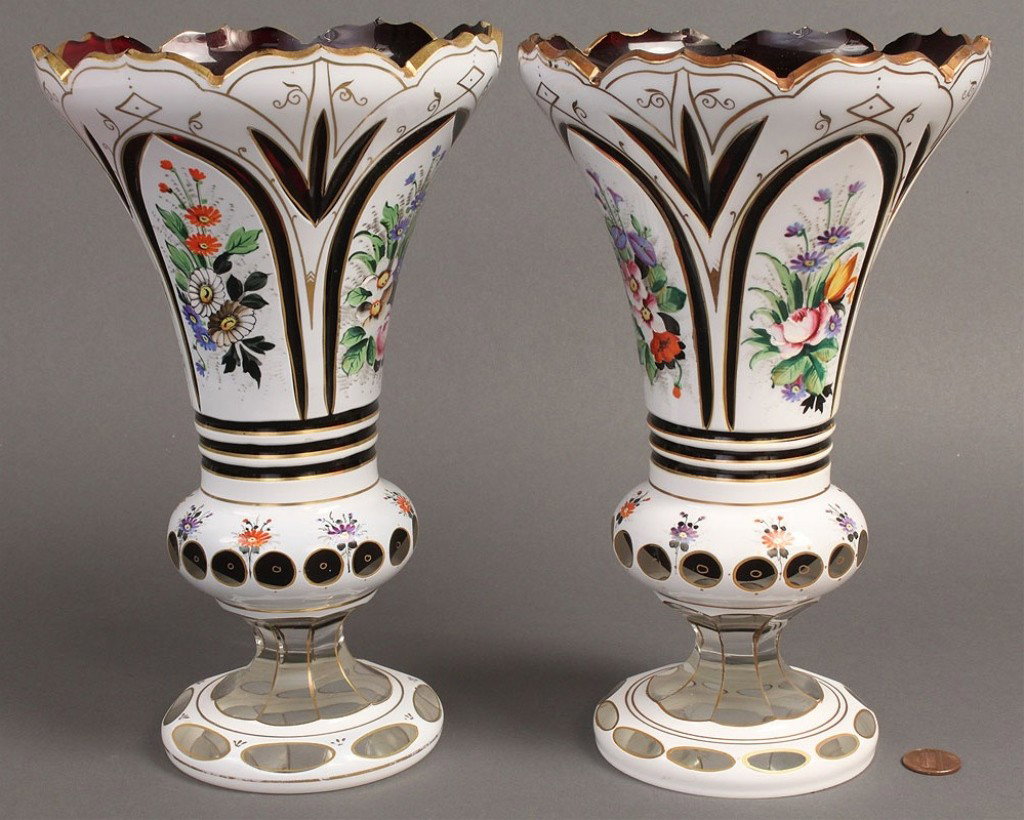 Pair of Bohemian Overlay Mantle Vases: Pair of Bohemian glass overlay and gilt decorated mantel or garniture vases, white cut to ruby glass on tops, white cut to clear glass on bases, floral decoration, flared and scalloped rims. 9-3/4" H.