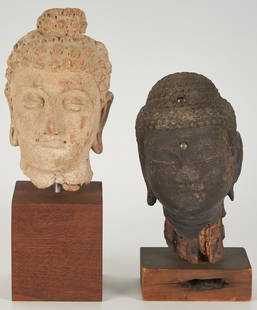 2 Asian Archaistic Ghandaran Style Buddha Head Sculptures: 1st item: Afghan Ghandaran style ceramic Buddha head with half-closed eyes, mounted to a square wooden stand with old sticker label. 11 1/2" H x 3 1/2" W x 4" D. Museum documentation states circa 4th