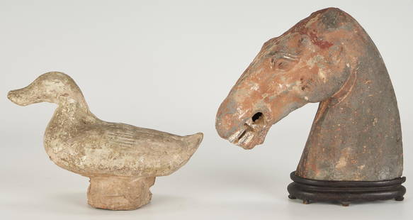 2 Asian Archaistic Sculptural Items, Tomb Figure & Terracotta Horse Head: 1st item: Chinese earthenware tomb figure modeled as a duck. 5 3/4" H x 8 3/8" W x 4 3/8" D. Museum documentation states Han period. 2nd item: Chinese terracotta horse head depicted with teeth bared,