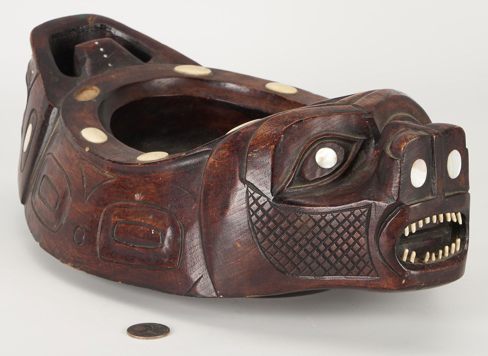 Tlingit Grease Bowl attr. Augustus Bean and Rudolph Watson: Tlingit carved wooden Grease or Effigy Bowl, attributed to Augustus Bean and/or Rudolph Watson (Tlingit, 1864-1951 / 1850-1926), seal form with inset abalone and bone. 14"L x 5"H. A Nashville, Tenness