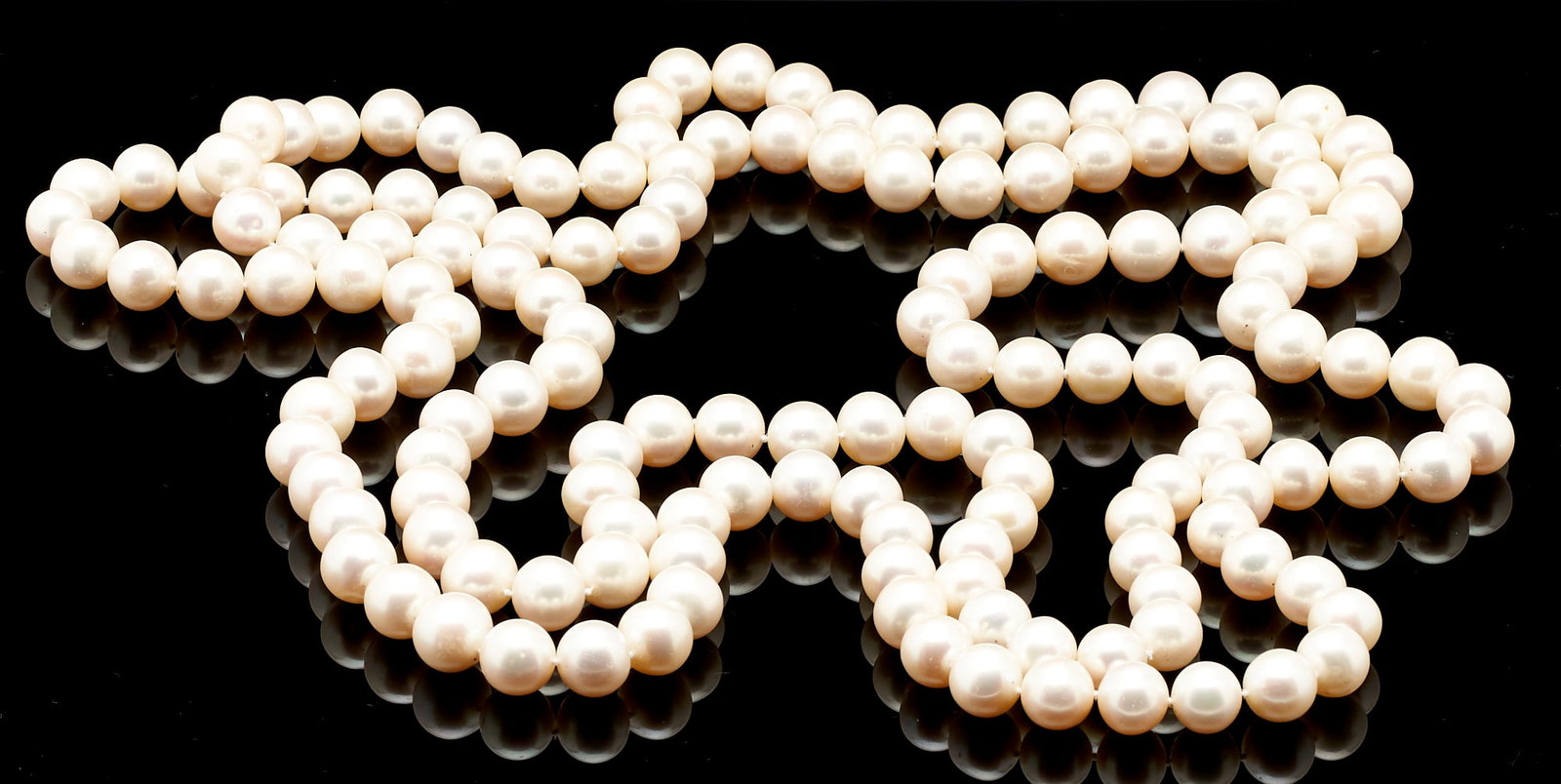 Ladies' Rope Length Pearl Necklace: Ladies' rope length pearl necklace featuring one hundred fifty-one (151) cultured pearls approximately 11mm each. The necklace is 64" L. PROVENANCE: Property from the Collection of Jo Ann Cline Yates,