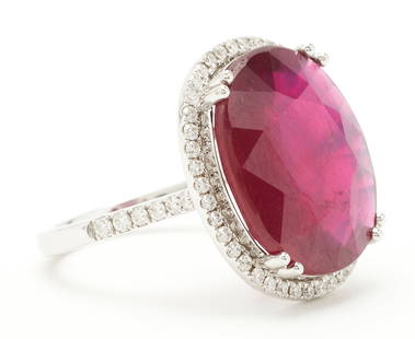 Ladies' 14K Gold & Ruby Ring: Ladies' 14K white gold ring featuring a natural but fracture-filled ruby approximately 10.76 carats, accented by forty-two (42) round brilliant diamonds approximately 0.42 carats together, Clarity-SI1