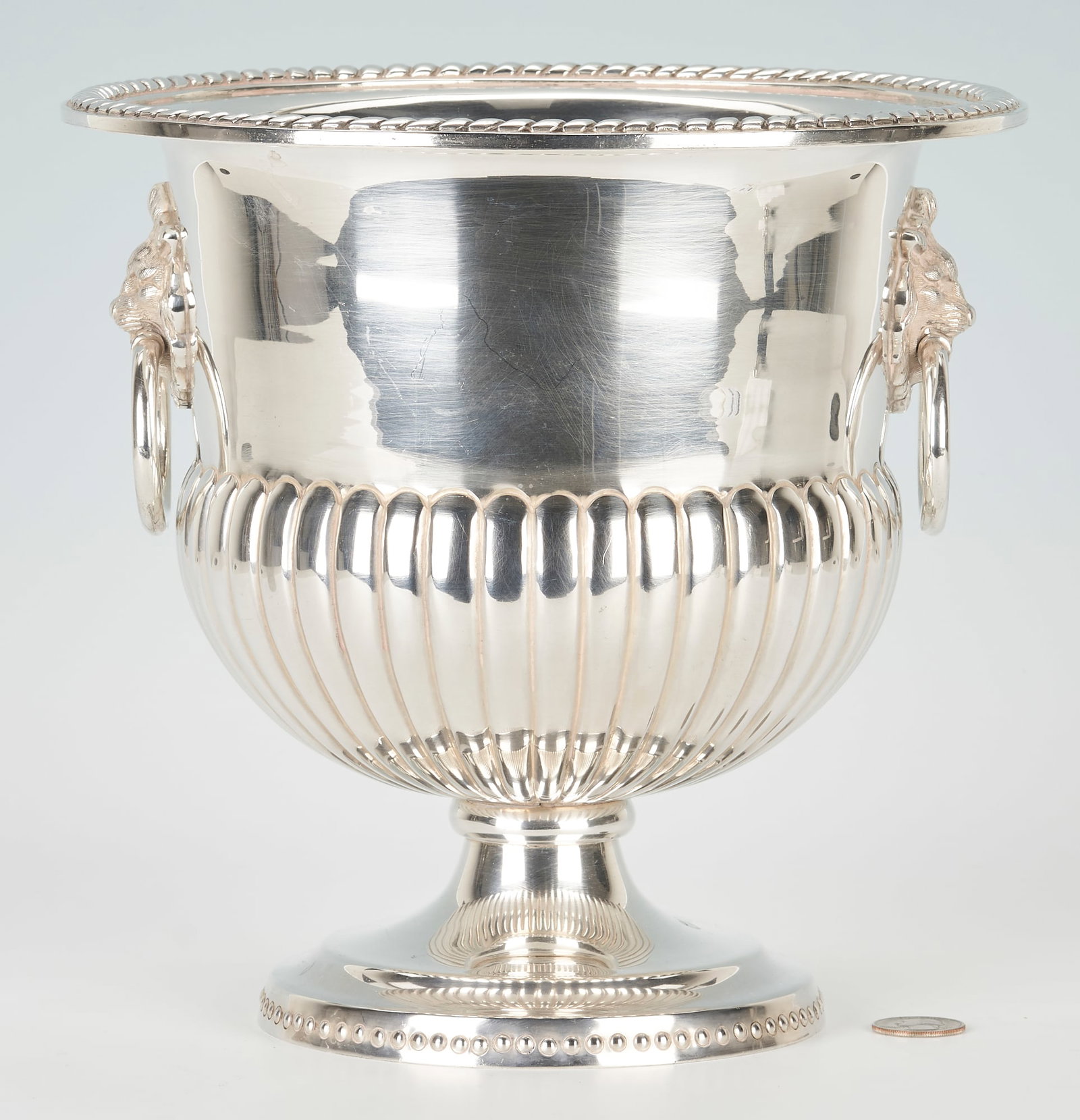 Rare Sanborns Mexican Sterling Wine Bucket or Urn: Rare Sanborns Mexican sterling silver wine cooler, campana form with lower lobed body, gadrooned rim, lion mask and ring handles, supported on a round foot with beaded rim. Stamped SANBORNS MEXICO STE