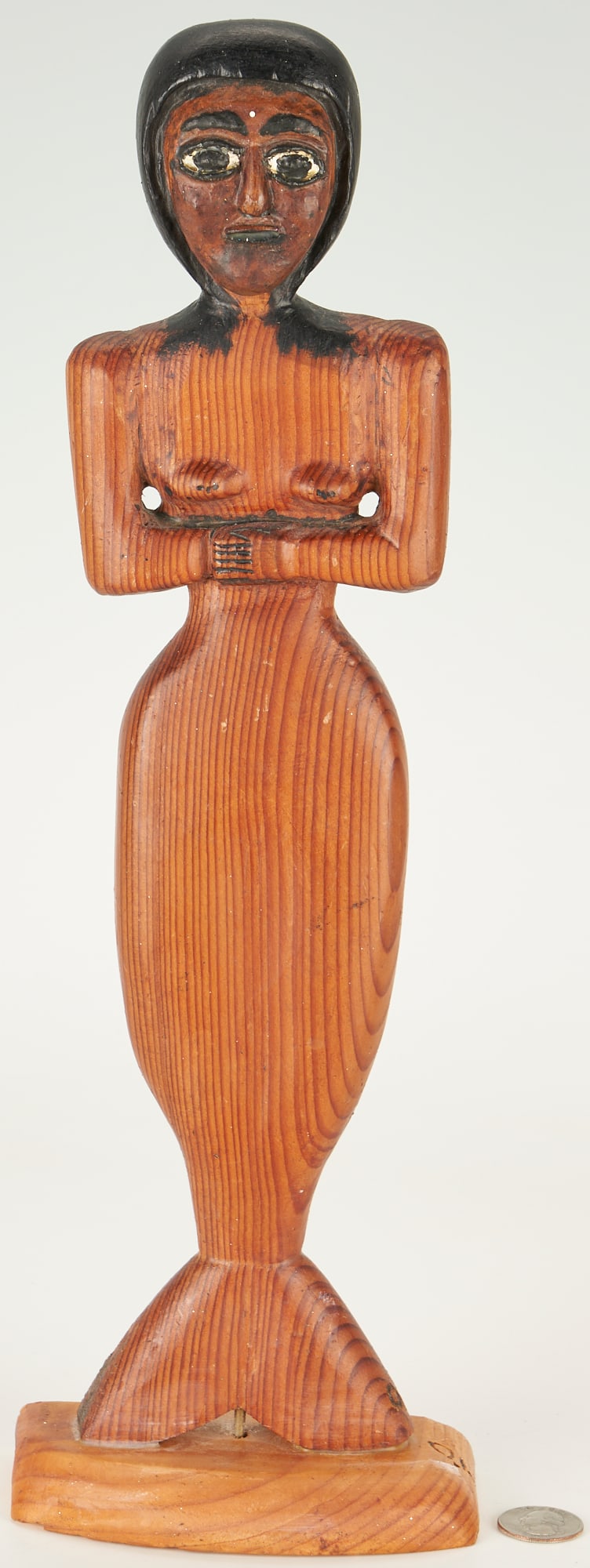 O.L. Samuels Carved Folk Art Mermaid: Ossie Lee Samuels (Georgia, 1931-2017) outsider art carved wood sculpture of a mermaid with arms folded below her nude breasts, having dark ebonized "hair". Initialed at bottom of fin and on base. 16 