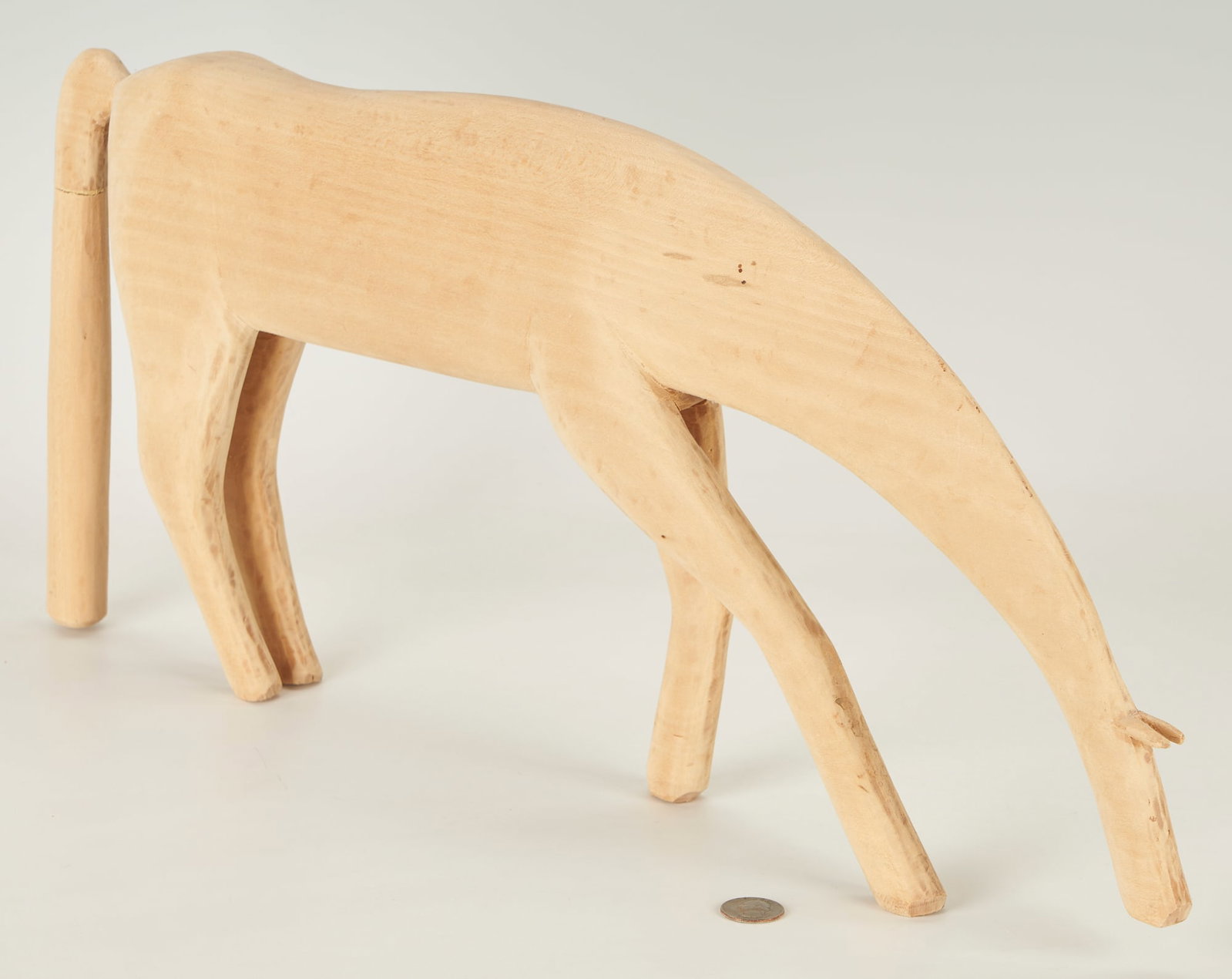 Garland and Minnie Adkins, Natural Horse: Minnie Adkins and Garland Adkins (Kentucky, 20th century) wood folk art carving of a bowing horse. Signed "G & M Adkins" and dated 1997 in pen to underside of belly. Also signed with C in circle to un