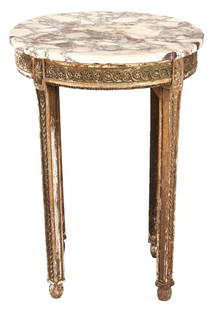 Small Oval French Louis XVI Table w/ Marble Top: A French Louis XVI table consisting of a breche violette marble top over a carved and gilt wood frame with carved apron, and carved straight legs. 29 3/8"H x 22 7/8" W x 21 1/2" D. French, Late 19th/e