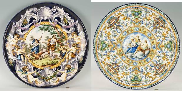 2 Italian Ceramic Chargers with Mythological Scenes, incl. Majolica: Two (2) large Italian ceramic chargers having polychrome decoration and central Neoclassical mythological scenes, including one (1) Majolica Istoriato charger with goddesses and a putto seated in the