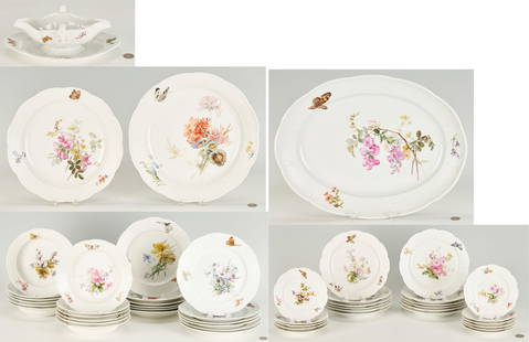 52 Pcs. Meissen Floral Porcelain Dinnerware, Service for 12: A Meissen hand-painted polychrome porcelain dinnerware set, 52 total pieces, with molded basket-weave rims and decorated with various floral sprigs and butterflies. Set includes twelve (12) dinner pla