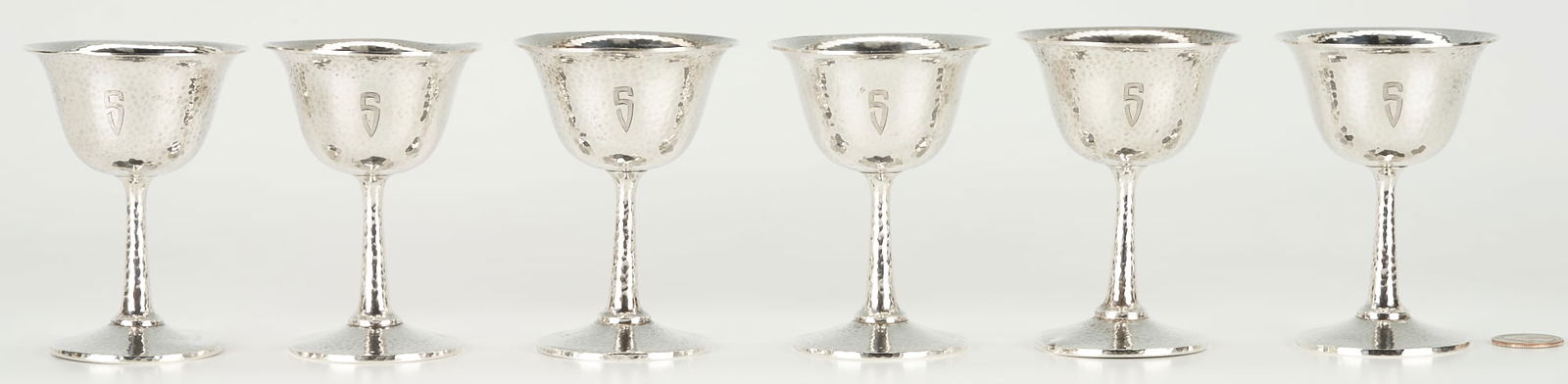 6 Brooks Hammered Sterling Goblets: Six (6) Brock & Co. Arts & Crafts / Art Deco Period sterling silver wine goblets with hand hammered surfaces, flaring rims and weighted bases. 4"h. Monogrammed S. Note: Brock & Co. was founded in Los
