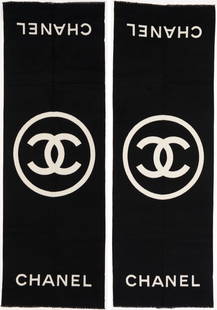 Pair of Chanel CC Logo Reversible Cashmere Shawls: Chanel CC logo reversible fringed cashmere shawl or stole in colors of black and white. Both retain the original tissue with Chanel label and Chanel bag. 78" L x 25" W. PROVENANCE: East Tennessee Esta