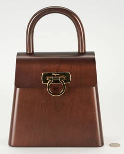 Salvatore Ferragamo Gancini Wooden Flap Bag: Salvatore Ferragamo Gancini wooden flap bag in dark brown finish, trapese hinged body, black lined interior, and goldtone hardware. Logo incised to one side of the body and to clasp. 12" H x 8 1/2" W