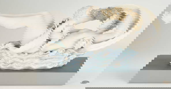 Lladro Porcelain Sculpture, The Flow of Life: Limited edition Lladro porcelain sculpture titled "The Flow of Life" designed by Jose Javier Malavia, released in 2006 and retired in 2015. Depicts a reclining mother figure resting on a blue wave bas