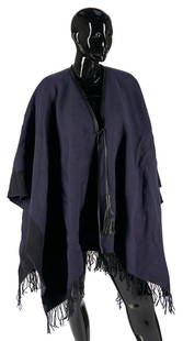 Hermes Reversible Wool, Cashmere & Leather Tassel Poncho: Hermes dark navy and black reversible wool and cashmere blend poncho with black leather trim and tassel closures, one size. Retains the original box. PROVENANCE: East Tennessee Estate.