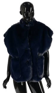Burberry Oversized Navy Faux Fur Vest: Burberry oversized navy faux fur vest with traditional pattern lining, two large pockets on the front, and logo buttons. Size XS/S. Includes attached retail tag and branded cover. PROVENANCE: East Ten