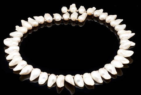 Tennessee Freshwater Pearl Choker Necklace: Ladies choker style necklace featuring forty-three (43) TN freshwater pearls. The necklace is 19" L. Note: Tennessee Freshwater Pearls are harvested from mussels. The mussels respond to irritants (lik