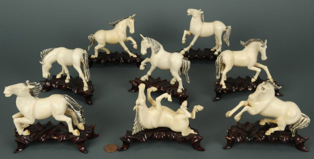 Eight Chinese carved ivory Horses of Mu Wang: Group of Chinese carved ivory figures depicting the eight Horses of Mu Wang, all in various poses - standing, resting, and running. Each with separate carved hardwood stand. Ranging in height from 2-1