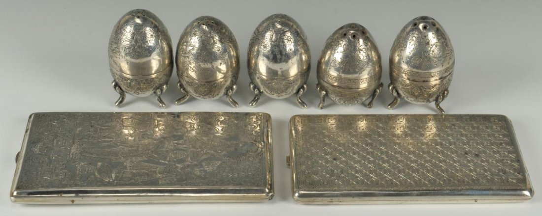 7 Persian Silver Items, Cases & Salts: Lot of 7 Persian silver items. 1st item - Two (2) Persian silver cigarette cases, one with maidens playing instruments in a feast setting (6" H x 3 1/4" W) and the other with an all over geometric des