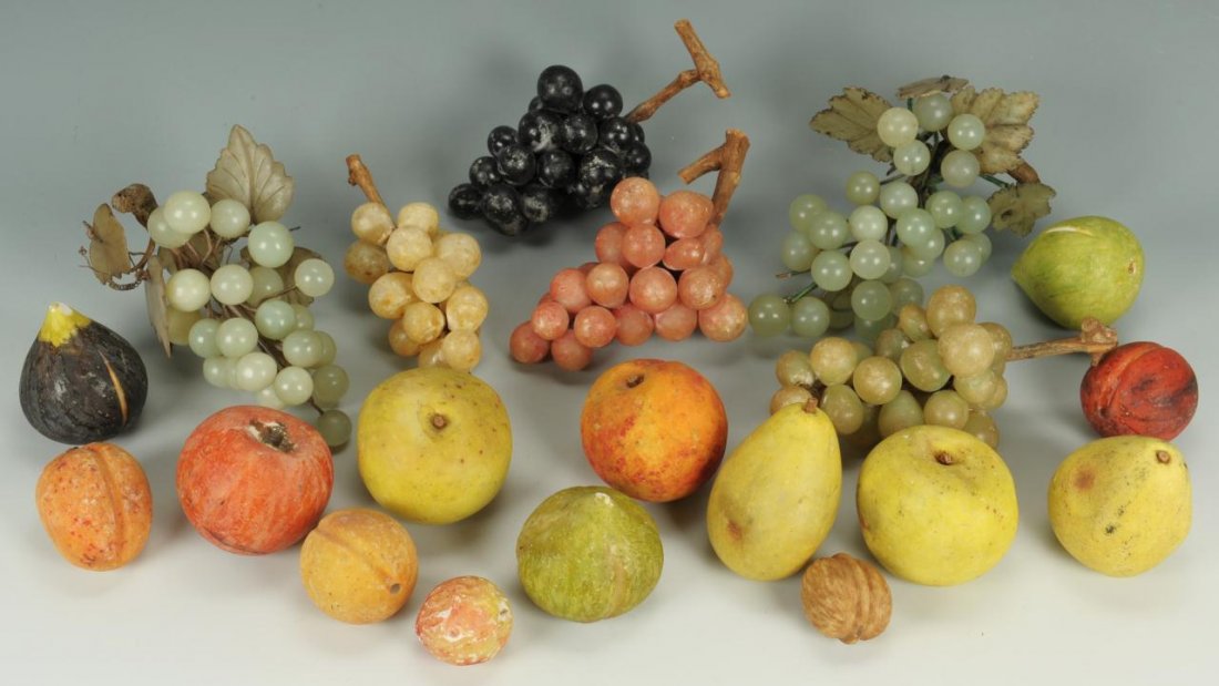20 pieces of Stone Fruit: Twenty pieces of assorted marble and other stone fruit including red and green grape clusters, nut, pear, fig, apple, etc. Ranging in size from 1-1/2" to 7" L. Continental, circa 1900 and later, with
