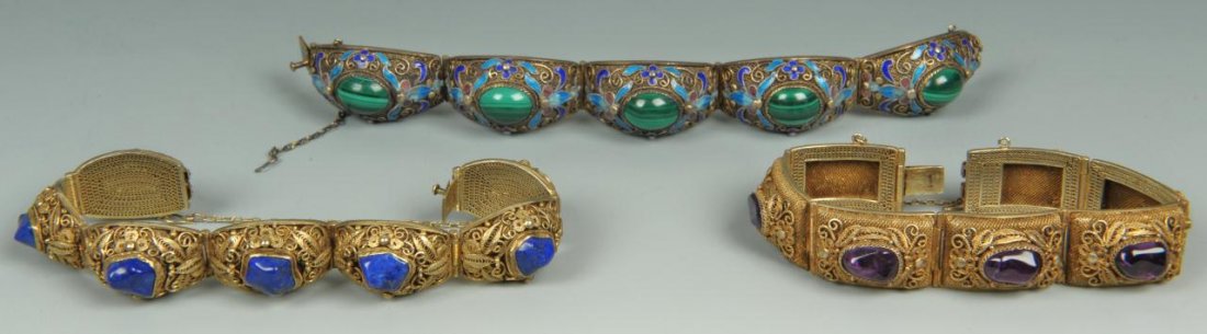 Three Chinese Silver and Stone Bracelets: Three Chinese Silver and Stone Bracelets. (1) Gilt-silver filigree and cloisonne link bracelet with inlaid malachite, 7" L, with safety chain. (2) Gilt-silver filigree bracelet with floral motif and i