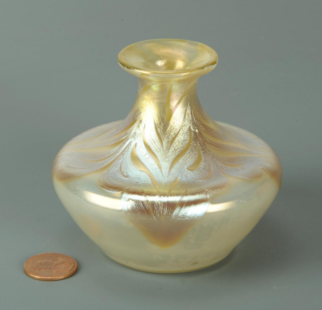 Small Loetz Phanomen art glass vase, signed: Art Nouveau Loetz Phanomen genre vase, flared neck with an iridescent pulled design extending over a bulbous, tapering body. Signed "Loetz Austria" on base. 3"H x 3-1/4" diameter. Circa 1900.