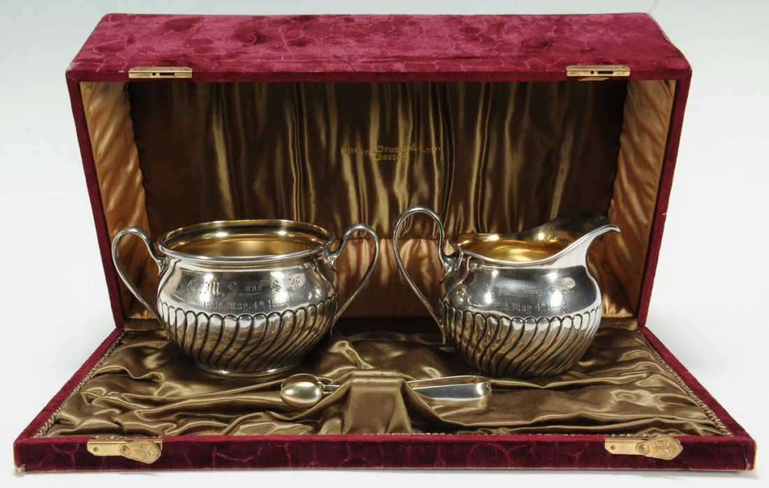 Shreve Crump & Lowe Presentation Silver Set: Shreve, Crump, and Lowe Sterling presentation creamer (3 1/2" H), sugar (3" H), and tongs (4" L) presented as a 30th wedding anniversary present. The creamer and sugar have swirling lobed bodies and b