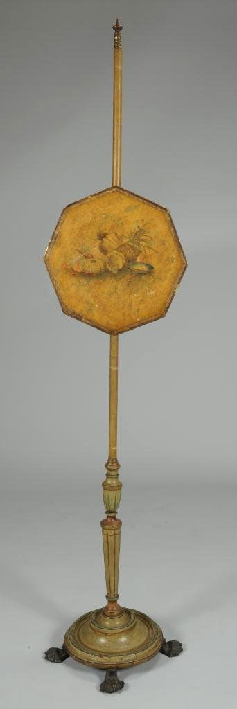 Regency / Empire Painted Yellow Firescreen: Regency / Empire green and yellow polychrome decorated fire screen. Piece features and orthogonal screen painted sea shell decoration on large turned pole with iron base and brass hairy paw feet. 61"