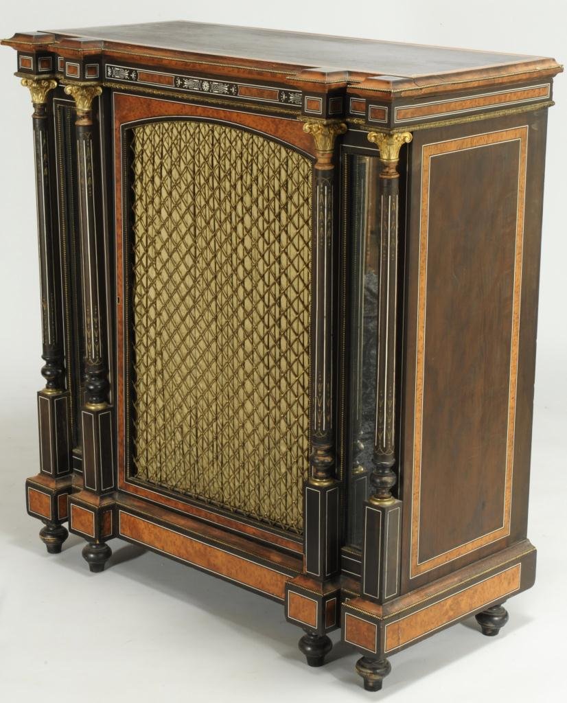 Aesthetic Movement Style Cabinet: Aesthetic movement style cabinet with ebonized primary wood and veneered maple inserts surrounded with simulated ivory inlay. The top is edged with gilt-brass beaded molding over a large central door 