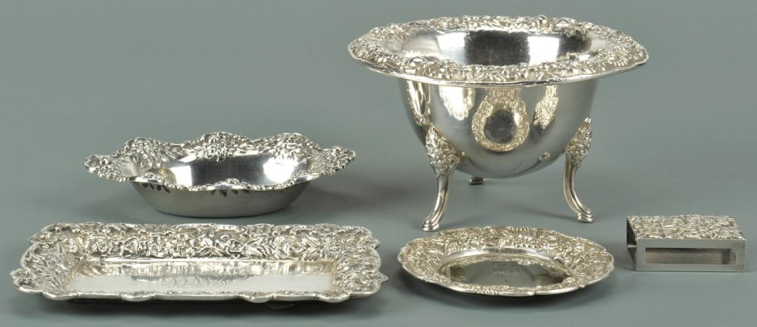 Five Kirk Repousse sterling silver table items: 5 pieces S. Kirk & Son Sterling Repousse pattern table items including a round candy dish on tripod feet, card tray, oval candy dish, small round dish and match box. Sizes range from 5" W x 3" H to 1-