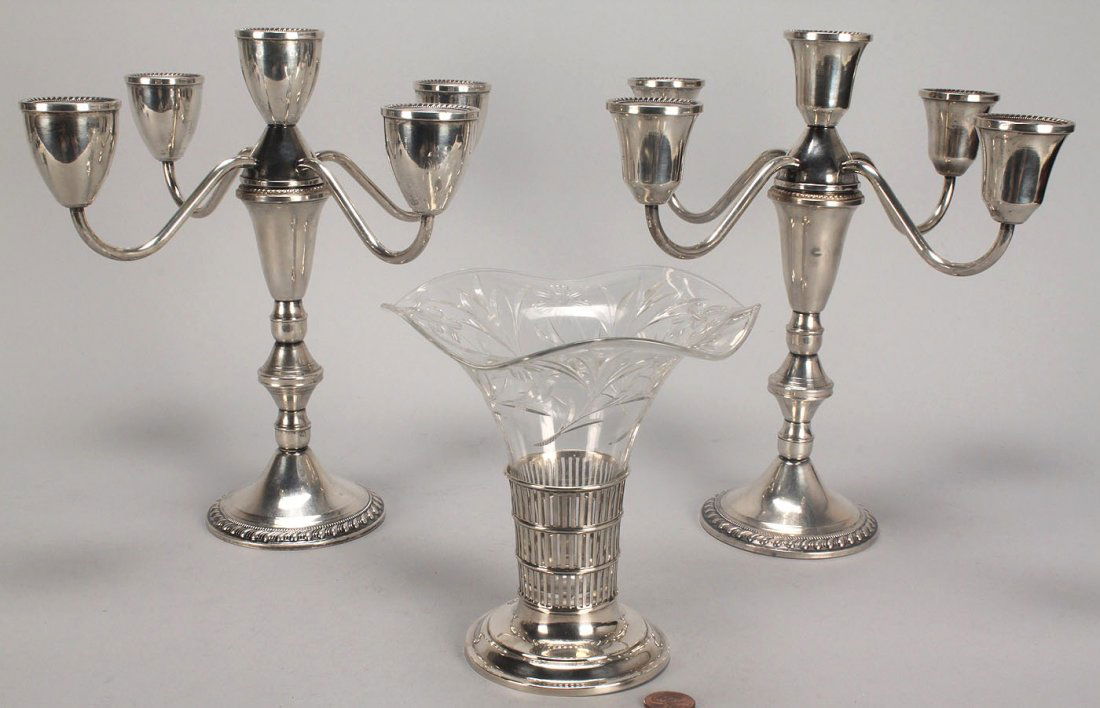 3 Silver Table Items, Candelabra and Vase: Three (3) silver table items including a pair of weighted sterling 5-arm candelabra by Duchin (9 1/2" H) and a sterling vase with base marked Bailey, Banks and Biddle with an etched crystal insert (5