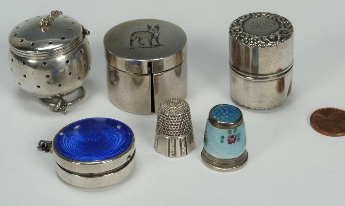 Group of six silver novelties inc. sewing: Six silver novelties including a tea infuser ball, mark for Simons Bros. Sterling; a Thimble Holder with repousse band at top and base, monogrammed and marked Sterling; a thimble marked sterling silve