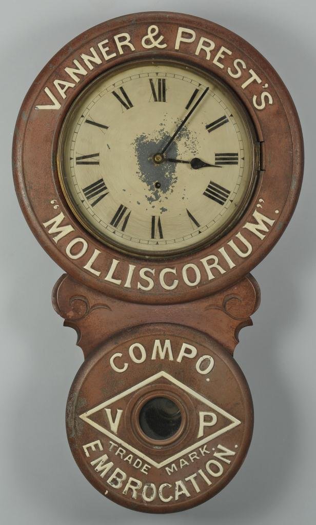 Vanner and Prest's Advertisement Clock: Early advertisement clock "Vanner and Prest's Molliscorium Compo Embrocation" with works by The British United Clock Co., Birmingham, England featuring a painted metal dial, 8-day spring driven time o