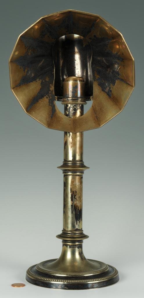 Old Sheffield hooded candlestick: Early spring loaded hooded candlestick by Hawksworth Eyre and Company of Sheffield, England. Silver plate over copper. 15" H x 6 3/4" W. Second quarter 19th century.