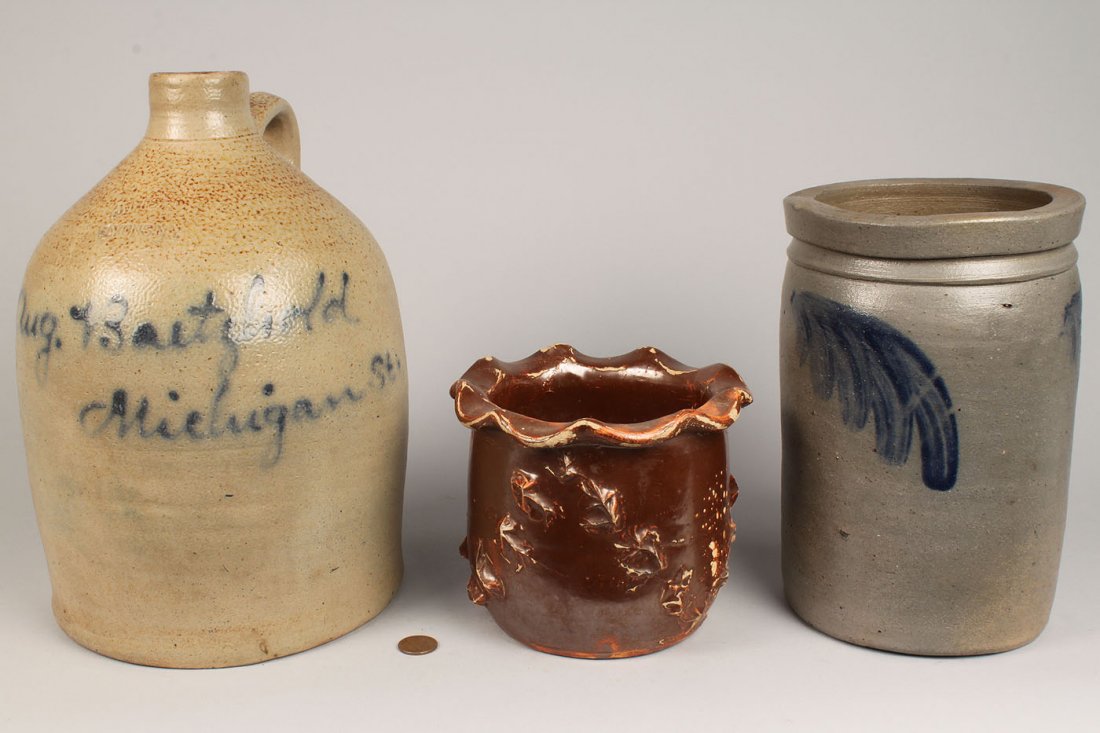 Grouping of 3 Stoneware Items: Lot of three (3) stoneware pottery items including a preserving jar with cobalt feathering (8 1/8" H); a flower pot with scalloped edge and raised decoration to body (4 1/2" H); and a Buffalo, New Yor