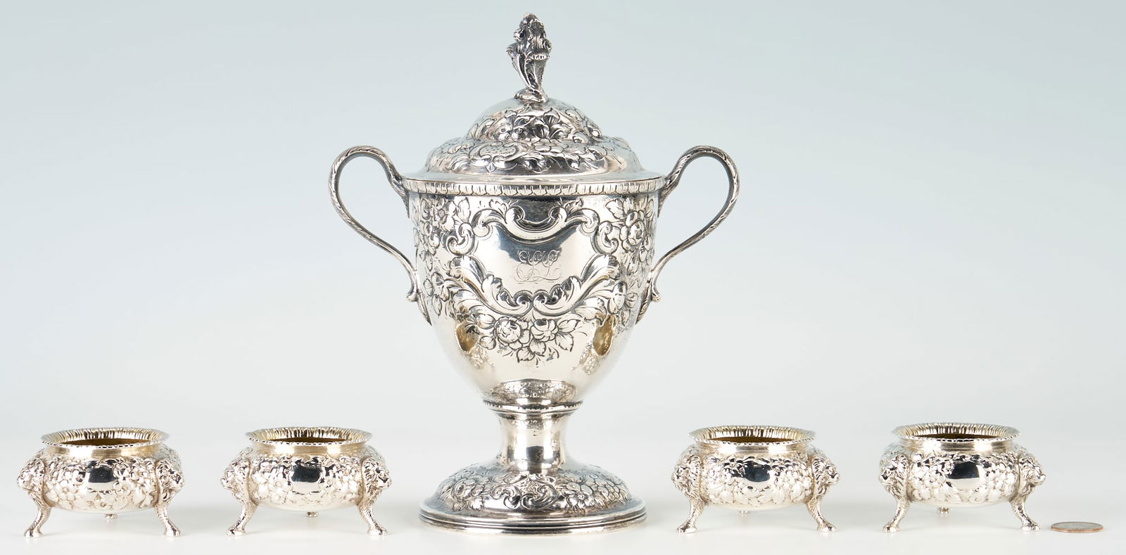 Baltimore Repousse Coin Silver Sugar Bowl and Salts inc. A.E. Warner: 1st through 4th items: Set of early Baltimore Repousse rose pattern salt dishes, circular form with lion head caryatid masks and hoof feet, each stamped A.E. WARNER and "11.2" in separate rectangles t