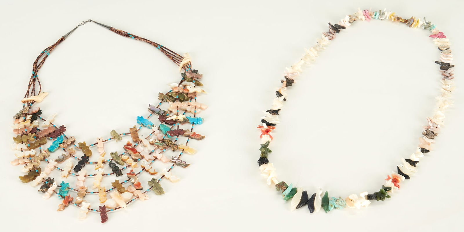 2 Native American Zuni Fetish Necklaces: Two (2) Native American Zuni fetish necklaces including one (1) consisting of five beaded strands set with various hardstone and mother-of-pearl carvings depciting primarily foxes and birds and one (1