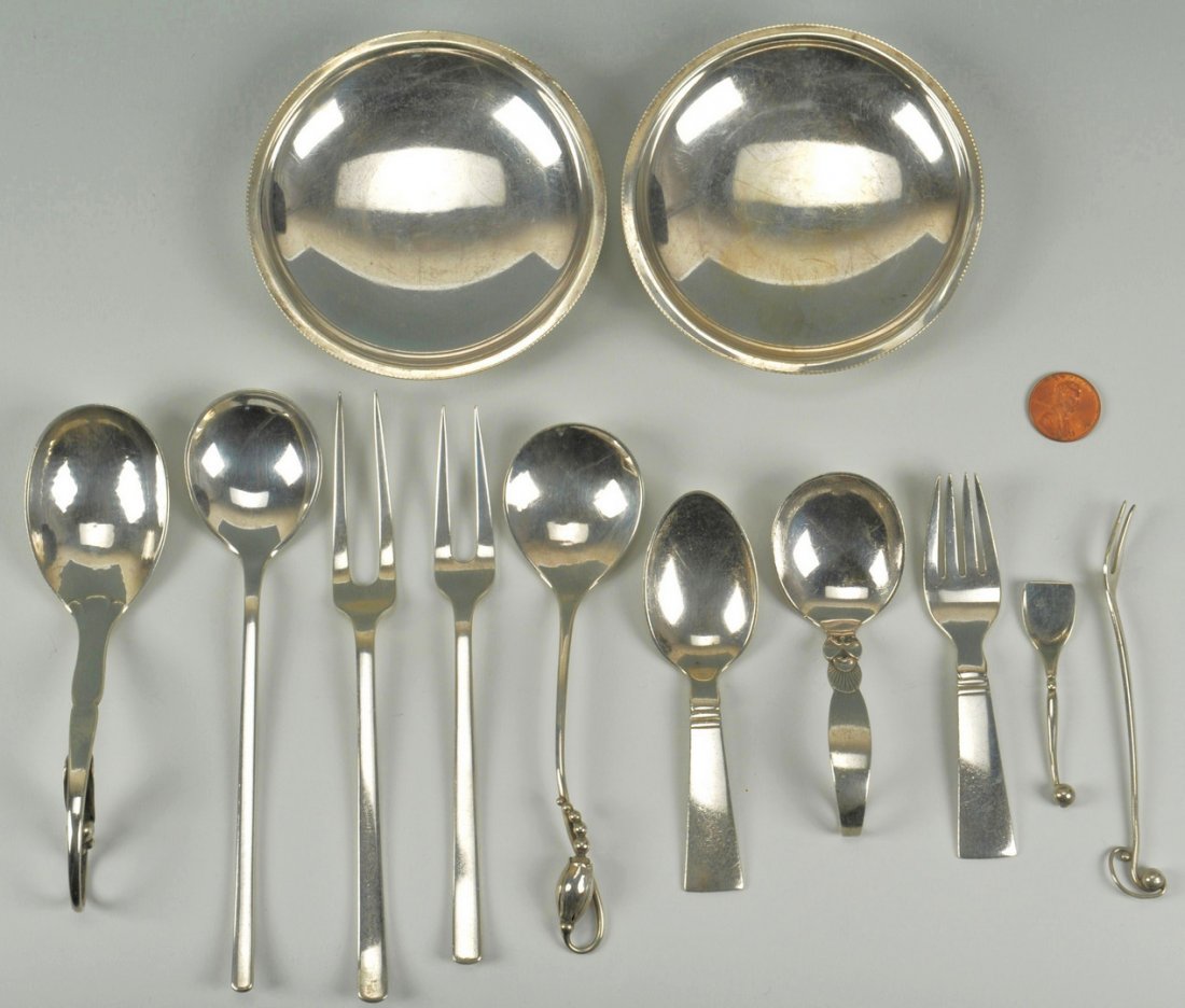 Georg Jensen, Kay Bojesen and Grun Sterling: Assorted Danish sterling pieces. 7 assorted pieces Georg Jensen flatware and small serving pieces, various Jensen hallmarks, including a baby spoon and fork, a Cactus pattern curved handle baby spoon,