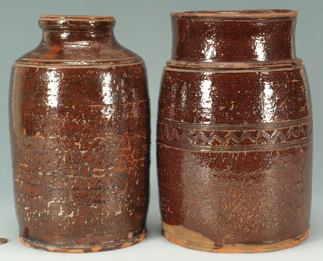 2 East TN Redware jars, one sine wave, attrib. Cai: Lot of two East Tennessee redware pottery storage jars, one with sine waves. Both attributed to the Cain pottery. Item 1: Redware storage jar having straight sides, shoulder and channeled rim with sin