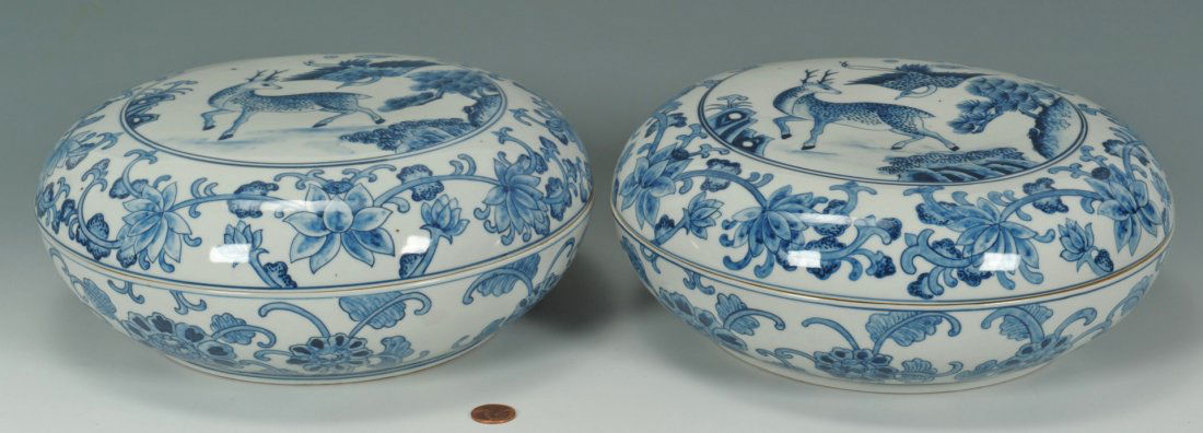 Pair of Chinese Blue & White Covered Bowls: A pair of Chinese blue and white under glazed porcelain covered bowls, the tops with spotted deer, stork, pine tree and magic fungus decoration and a floral band. The bases with leaf and flower decora
