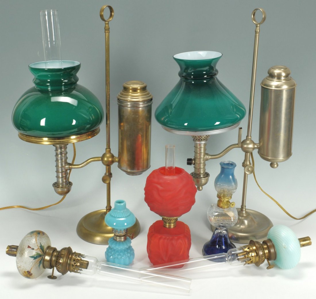 Grouping of 7 American Lamps: Grouping of American lighting. Item 1: Victorian blue satin glass peg lamp with brass fittings. Approx. 6-1/2" L (without shade). Item 2: Peg lamp with floral hand painted textured glass font and bras