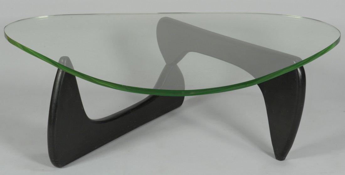 Isamu Noguchi IN-50 Coffee Table: Isamu Noguchi Model IN-50 Coffee Table with two part lacquered wooden base which pivots on an aluminum rod and supports a 3/4" glass top with green edges. 15-3/4" H x 50" W x 36" D. Mid 20th century. 