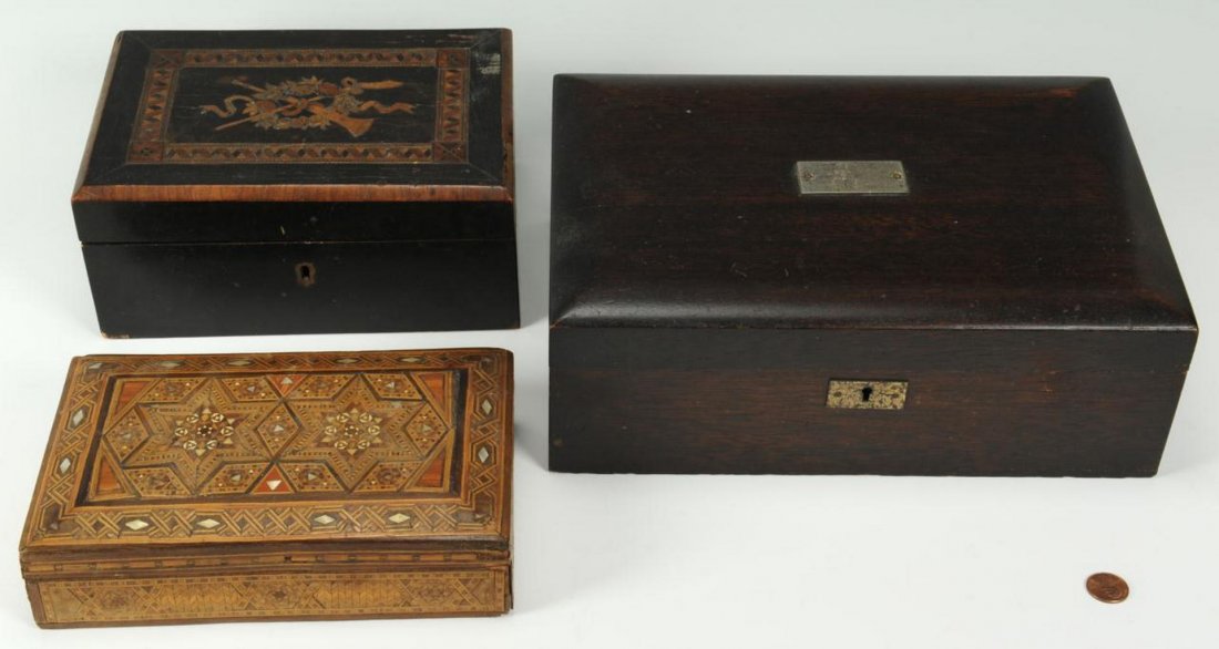 Humidor and Two Decorative Boxes: Grouping of 3 boxes including one (1) Mahogany humidor with metal liner (4" H x 11-1/2" W x 8" D), one (1) box with veneer and inlaid top having a garland and bugle design (4" H x 8-1/2" W x 6" D) and